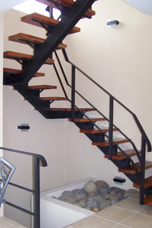 The innovative design includes this graceful stairway.